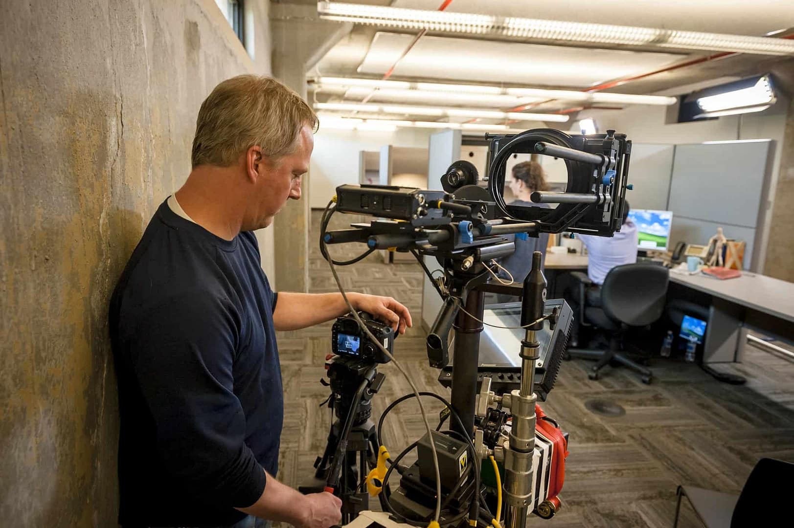 man videotaping a woman